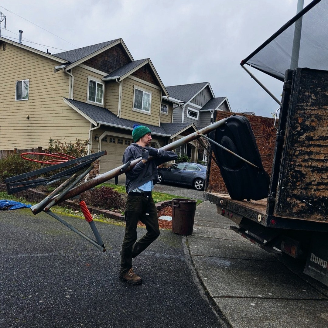 Team loading a couch for junk removal